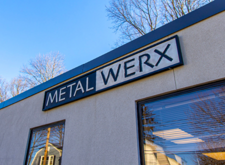 The exterior of the Metalwerx building with a sign stretching across the top of the building with the name Metalwerx
