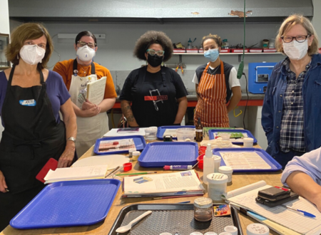 A group of students with instructor Tanya Crane in the Metalwerx classroom