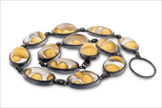 Gardner.dark silver and gold bubbles necklace