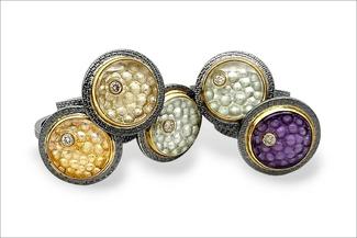Gardner.five carved rings in stone and dark silver