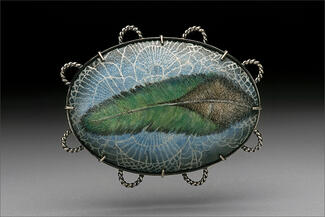 Hur.blue enamel with green feather