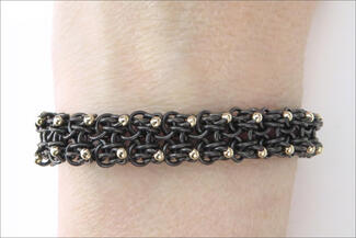 Karon.dark bracelet with gold dots