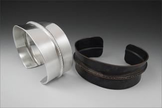 Lawton.two cuffs in silver and copper