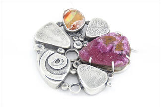 McKeown.silver brooch with tear drop shapes