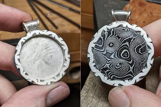 Vanaria.File Carved Pendant with Damascus