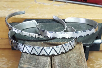 Vanaria.File Carved cuffs