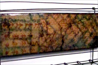 Wells.Yellow Red Green Brown Steel Rectangle Close up
