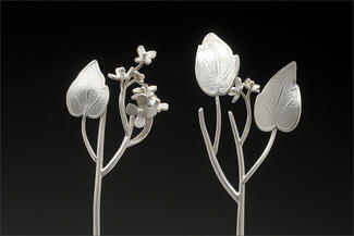 Werger.branch with flower in silver