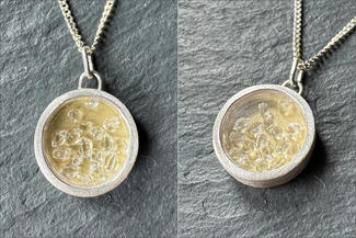 Acebo.silver and gold pendant with clear stones