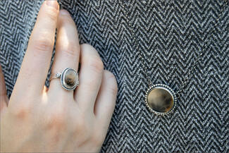 Glimp.ring and necklace on textured shirt