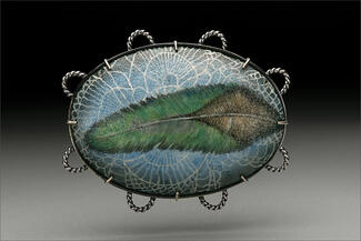 Hur.enamel brooch of blue and green feather