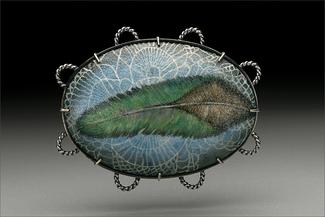 Hur.enamel brooch of blue and green feather