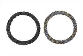 Two woven metal bracelets