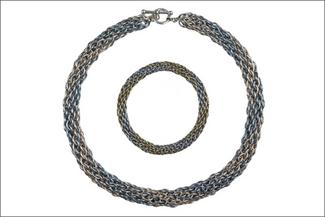 A woven metal necklace and bracelet