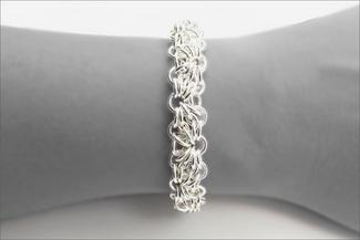 Karon.silver bracelet on wrist in black and white