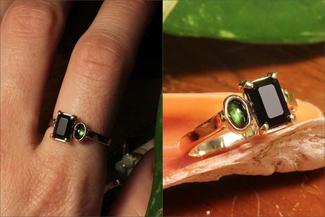 Keast.prong ring with green and black stone