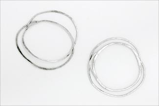 Werger.hammered bracelets in bright silver