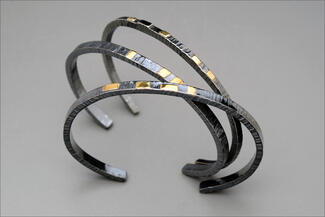Werger.stacking silver and gold cuffs