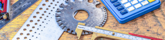 Various gauge measuring tools on a workbench
